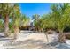 Pathway to home lined with palm trees and tropical plants at 5 Pointe Way, Placida, FL 33946