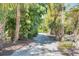 Peaceful path meanders through tropical vegetation at 5 Pointe Way, Placida, FL 33946