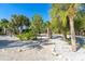 Landscaped area with tropical plants and a walkway at 5 Pointe Way, Placida, FL 33946