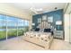 Spacious main bedroom with water views and a coastal color scheme at 5 Pointe Way, Placida, FL 33946