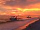 Stunning sunset over the ocean with boats anchored offshore at 5 Pointe Way, Placida, FL 33946