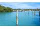 Calm waterway view with mangrove trees and a ferry in the distance at 5 Pointe Way, Placida, FL 33946