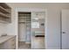 Bedroom closet featuring mirrored doors revealing neutral paint and tiled floors at 5031 Lucine Rd, Venice, FL 34293