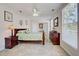 Spacious bedroom featuring neutral walls, a ceiling fan, and coordinated furnishings at 5031 Lucine Rd, Venice, FL 34293