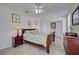 Cozy bedroom with a ceiling fan, light walls, and coordinated furnishings at 5031 Lucine Rd, Venice, FL 34293