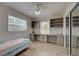 Bedroom with tile floor and a built in desk with shelves and drawers at 5031 Lucine Rd, Venice, FL 34293