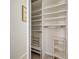 Walk-in closet featuring built-in shelves and closet rod for versatile storage and organization at 5031 Lucine Rd, Venice, FL 34293