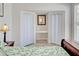 Bedroom featuring walk-in closet with built-in desk and shelving. The window brings in natural light at 5031 Lucine Rd, Venice, FL 34293