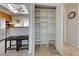 Open closet with bright white shelving offers an abundance of storage at 5031 Lucine Rd, Venice, FL 34293