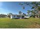 Charming single-story home featuring a screened-in porch and a well-maintained lawn, offering inviting outdoor living at 5031 Lucine Rd, Venice, FL 34293