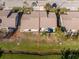 Aerial view of a residential neighborhood featuring backyard pools and landscaped lawns at 525 Foxwood Blvd, Englewood, FL 34223