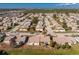 Aerial view of a residential neighborhood with tree-lined streets, landscaped lawns, and beautiful home exteriors at 525 Foxwood Blvd, Englewood, FL 34223