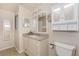 Well-lit bathroom featuring granite countertops, tile flooring, and updated fixtures at 525 Foxwood Blvd, Englewood, FL 34223