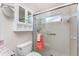 Well-lit bathroom with a toilet, shower and granite-topped sink at 525 Foxwood Blvd, Englewood, FL 34223