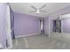 Cozy bedroom with soft carpet, ceiling fan, neutral-toned walls, and a mirrored closet at 525 Foxwood Blvd, Englewood, FL 34223