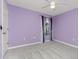 Bedroom with neutral carpet, a ceiling fan, and a window with decorative curtains at 525 Foxwood Blvd, Englewood, FL 34223