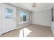 Bright dining room with large window and door with natural light at 525 Foxwood Blvd, Englewood, FL 34223