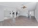 Living room showing flooring and view into the kitchen and entry at 525 Foxwood Blvd, Englewood, FL 34223