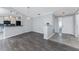 View of living room showcasing wood floors, an open floor plan, and a view to the kitchen at 525 Foxwood Blvd, Englewood, FL 34223