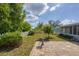 A backyard featuring a brick-paved area, birdbath and a fenced yard at 5280 Grobe St, North Port, FL 34287