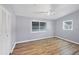 Bedroom with wood-look flooring and natural light at 5280 Grobe St, North Port, FL 34287