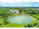 Aerial view captures a natural mineral springs pool surrounded by mature trees at 5280 Grobe St, North Port, FL 34287