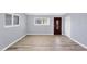 A living room featuring laminate floors and natural light at 5280 Grobe St, North Port, FL 34287