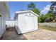 Outdoor shed with white siding and a brick-paved outdoor space at 5280 Grobe St, North Port, FL 34287