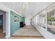 Spacious sunroom with bright light from many windows and tile-patterned carpet at 5280 Grobe St, North Port, FL 34287