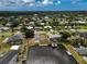 Expansive aerial view showcasing a waterfront property with a private boat dock on a sunny day at 621 Tarpon Way, Punta Gorda, FL 33950