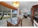 Bright dining area with a glass-top table and view to the well-maintained front yard at 621 Tarpon Way, Punta Gorda, FL 33950