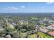 Expansive aerial view of a residential neighborhood with lush greenery and blue skies at 681 Olive St, Englewood, FL 34223