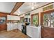 Bright kitchen featuring white cabinets, wood countertops, and stainless steel appliances at 681 Olive St, Englewood, FL 34223