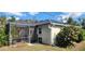 Backyard view showing a screened enclosure and landscaping at 6981 Tuxedo St, Englewood, FL 34224