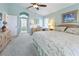 Relaxing bedroom with a cozy desk and a beautiful en-suite bathroom entrance at 70 Sportsman Rd, Rotonda West, FL 33947