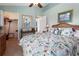 Cozy bedroom showcasing floral-patterned bedding and a closet at 70 Sportsman Rd, Rotonda West, FL 33947