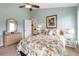 Cozy bedroom featuring island-themed decor, artwork, ceiling fan, and dresser at 70 Sportsman Rd, Rotonda West, FL 33947