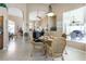 Dining area with a glass table, wicker chairs, and views of the lanai at 70 Sportsman Rd, Rotonda West, FL 33947