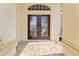 Elegant double front doors with decorative glass in a single Gathering home at 70 Sportsman Rd, Rotonda West, FL 33947