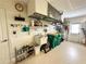 A well-organized garage with wall-mounted shelving, a sink, and storage for household items at 70 Sportsman Rd, Rotonda West, FL 33947