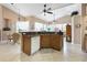 Kitchen features a breakfast bar, wooden cabinetry, and neutral countertops at 70 Sportsman Rd, Rotonda West, FL 33947