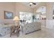 Comfortable living room featuring neutral paint, vaulted ceiling, tile flooring, and views of the lanai and pool at 70 Sportsman Rd, Rotonda West, FL 33947