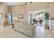 Bright living room with sliding glass doors to the lanai and neutral tile flooring at 70 Sportsman Rd, Rotonda West, FL 33947