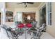 Covered patio featuring a table with seating, ceiling fan, and views of the interior of the home at 70 Sportsman Rd, Rotonda West, FL 33947