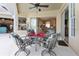 Covered patio featuring a table with seating, ceiling fan, and views of the interior of the home at 70 Sportsman Rd, Rotonda West, FL 33947