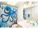 Cozy bathroom featuring bright octopus shower curtain and nautical-themed decorations at 7482 Palm Island Dr # 2522, Placida, FL 33946