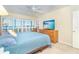 Comfortable bedroom featuring a large window and a dresser at 7482 Palm Island Dr # 2522, Placida, FL 33946