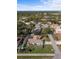 Aerial view of a home in a quiet neighborhood with mature trees and easy access to community amenities at 803 Diane Cir, Englewood, FL 34223