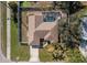 Aerial view of a single-Gathering home with a private pool, fenced yard, and well-maintained landscaping at 803 Diane Cir, Englewood, FL 34223