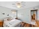 Bedroom with hardwood floors and view to en-suite bathroom at 803 Diane Cir, Englewood, FL 34223